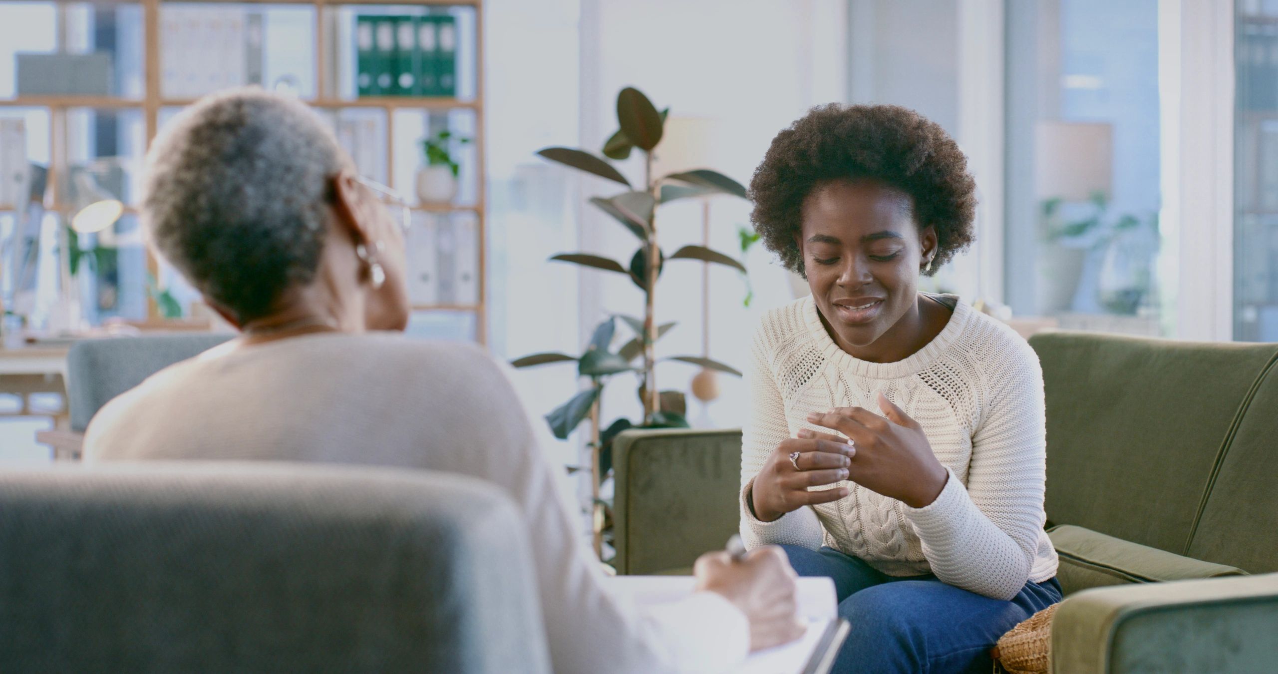 Supportive counseling conversation in a welcoming office